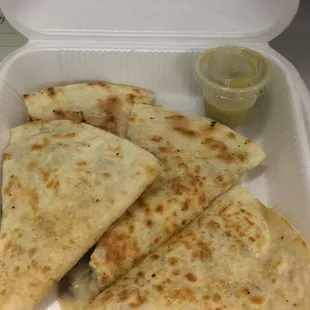 quesadillas in a styrofoam container