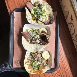 three tacos on a tray