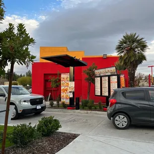 a car parked in front of a restaurant