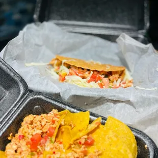 Chicken Nachos and small hard shell chicken taco