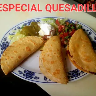 three quesadillas on a plate