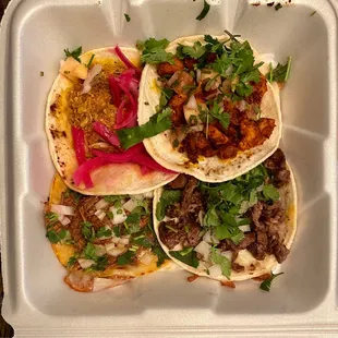 Pastor, chorizo, and pollo tacos