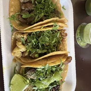 Tacos de asada, pollo and carnitas.
