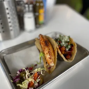 Fish and al pastor tacos