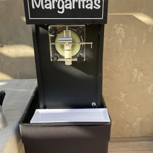 Tacos and margarita slushy machine.