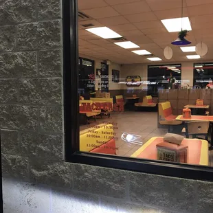 a view of a restaurant through a window