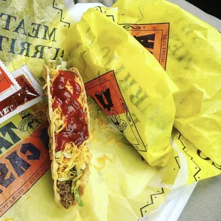 a taco with meat and cheese