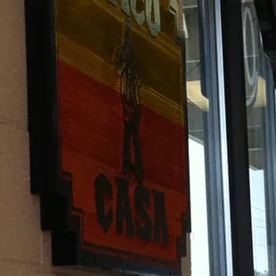 a sign on the wall of a restaurant