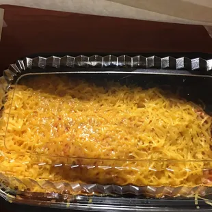 a large casserole in a plastic container