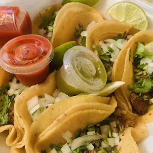 a plate of tacos and salsa