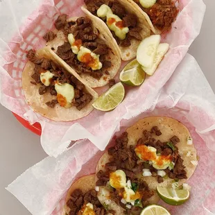 three tacos on a red plate