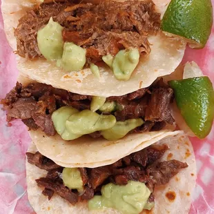 three beef tacos with guacamole