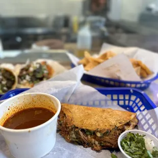 Birria tacos done right, with included consommé and fresh tortillas