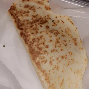 a tortilla in a styrofoam container