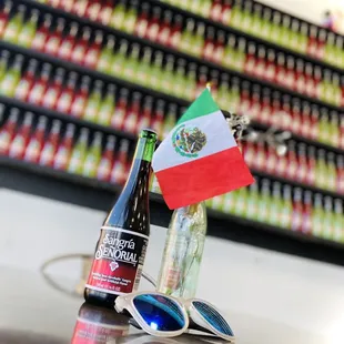 a bottle of beer and sunglasses