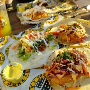 three tacos on a table