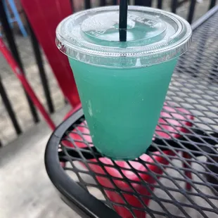 a green drink on a table