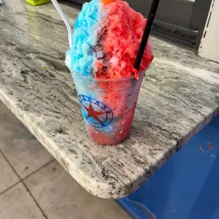 Sno cone house at the back of building. I got a tigers blood with blue coconut and cream.
