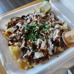 Baked potato with way too fatty pastor.