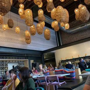 people sitting at tables in a restaurant