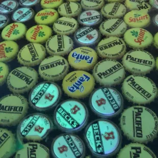 The bar is decorated in beer bottle caps
