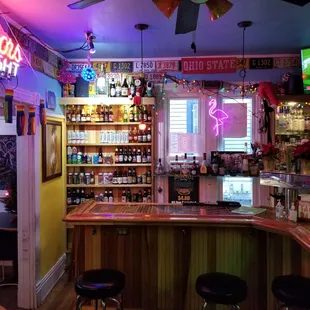 a bar with a neon sign
