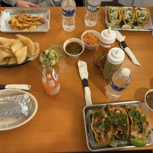 We got two taco platters - one pollo and one res (beef), quesadilla, burrito, and a chips and guacamole.