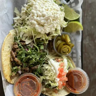 Sope on top, Carne Asada taco in middle and Carne Asada taco supreme on bottom