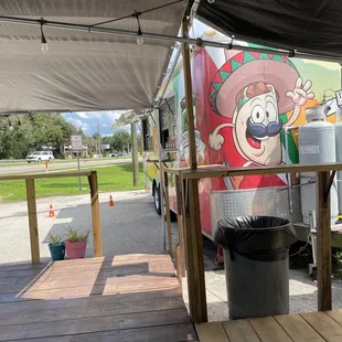 a taco truck parked in a parking lot