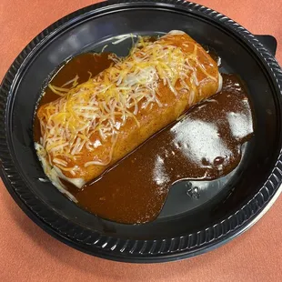 Ground beef burrito smothered with enchilada sauce