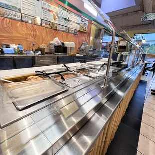 a man standing in front of a buffet