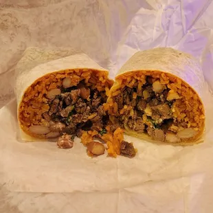 The burrito. Look at that meat to rice and bean ratio. They don&apos;t skimp on the meat!