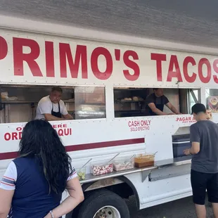people ordering food from a food truck