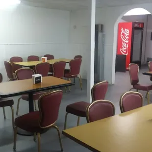 a restaurant with tables and chairs