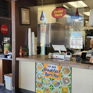 a restaurant counter with menus