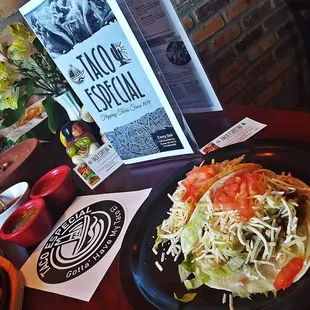 a plate of taco and a plate of salad
