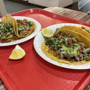 Assorted tacos if carnitas, carne asada, adobe pork.