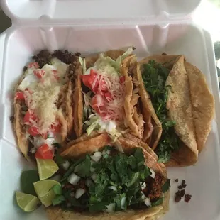 2 Chorizo (cilantro and onions) and 2 Beef Tacos (lettuce, tomatoes, sour cream, and cheese)