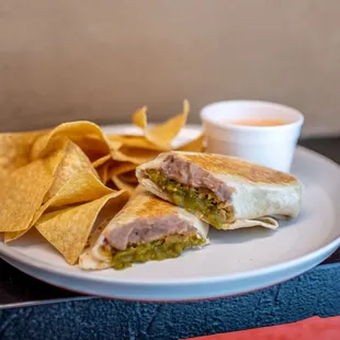 a plate with a sandwich and chips