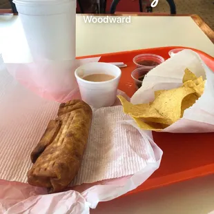 a hot dog and chips on a tray