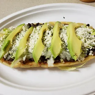 avocado and rice on a flat bread