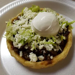 a close up of a taco on a plate