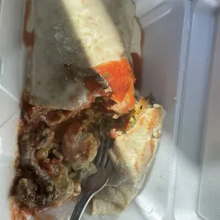Burrito Carne Azada I think. It&apos;s loaded with steak, rice, shrimp and chicken. I ask them to hold the beans.