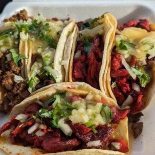 three tacos on a styrofoam container