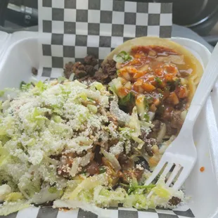 Sope and taco with green and regular salsa. Flavorfuland spicy