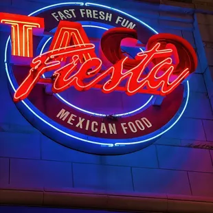 a neon sign for a mexican food restaurant