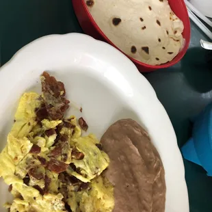 Bean and Tortilla Breakfast- comes with egg and a meat option(bacon) all for $4.29