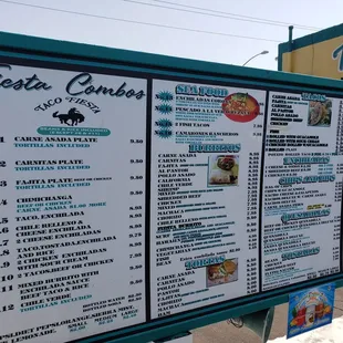 a man standing in front of a menu