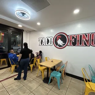 Co-owner, Antonia checking on her customers that found a seat