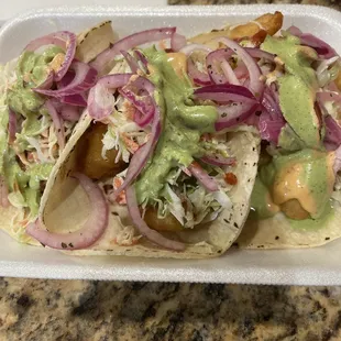 One shrimp and one fish. I added fish to a second tortilla cause there is a lot!